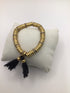J Crew brass disk + tassle Bracelet